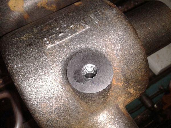 Hole re-drilled and tapped